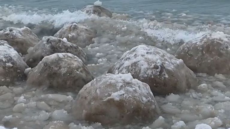 Huge ice boulders wash up on shore of Lake Michigan