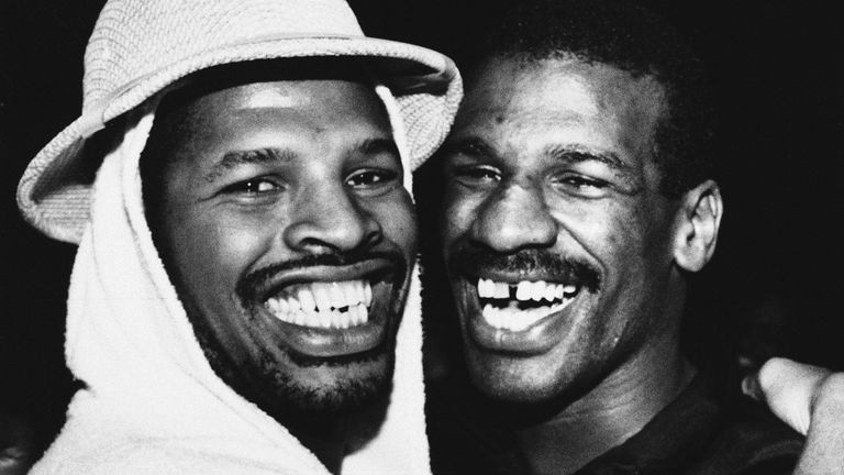 Leon Spinks, left, hugs his brother Michael after he defeated Larry Holmes in 1985. Pic: Associated Press