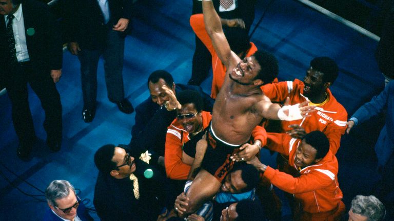 Leon Spinks&#39; entourage holds him aloft as he celebrates his victory over Ali. Pic: AP