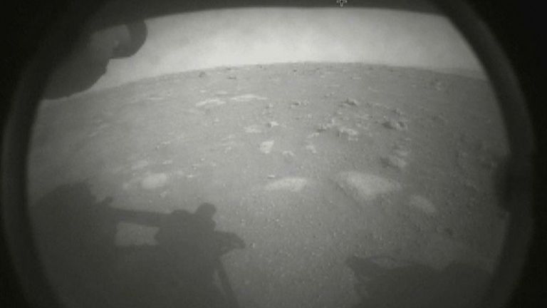 Shadows of Perseverance can be seen against the surface of Mars