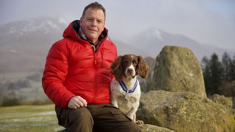 Owner Kerry Irving, 46, with English springer spaniel Max, in the Lake District, who will receive the PSDA Order of Merit, the animal equivalent of an OBE for his work as a virtual therapy
