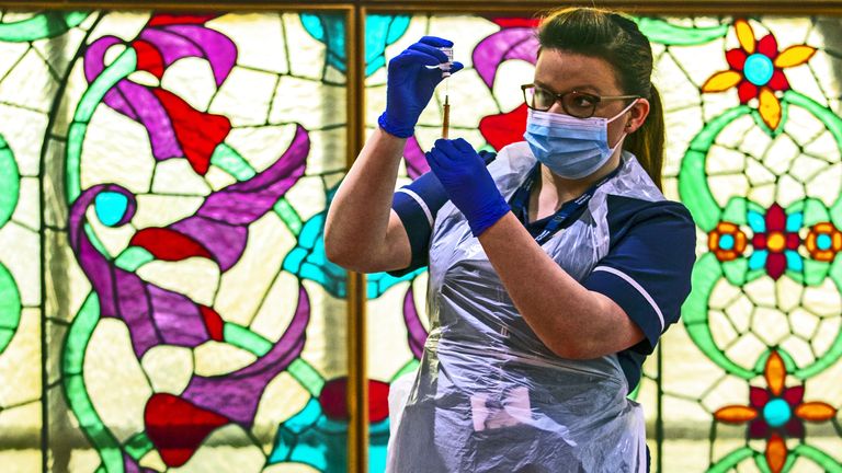 A nurse at Bradford Central Mosque, which has been converted into a community COVID-19 vaccination center