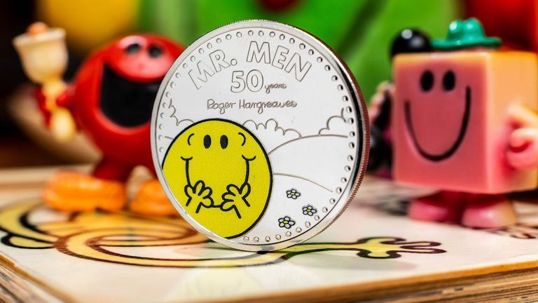 The Royal Mint unveils a new £5 Mr Happy coin, which launches today to celebrate 50 years of the Mr Men and Little Miss characters