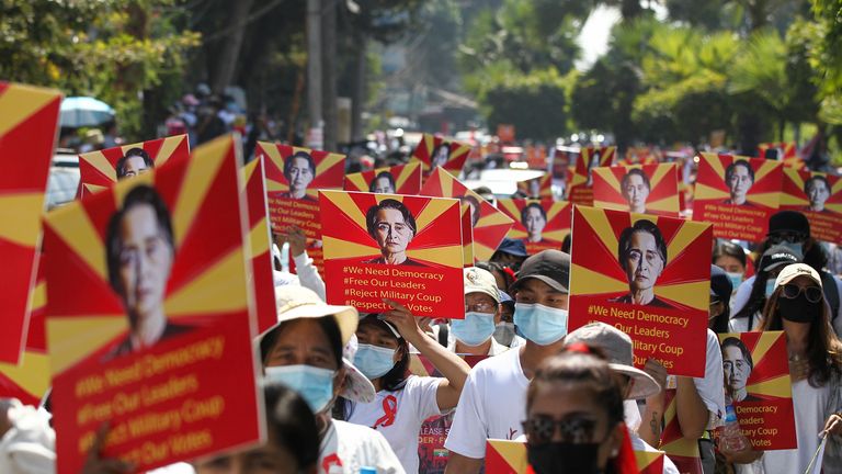  /// ...Anti-coup protesters hold posters with an image of deposed Myanmar leader Aung San Suu Kyi as they gather outside the UN Information Office in Yangon, Myanmar Sunday, Feb. 14, 2021. Vast numbers of people all over Myanmar have flouted orders against demonstrations to march again in protest against the military takeover that ousted the elected government of Aung San Suu Kyi. (AP Photo)....