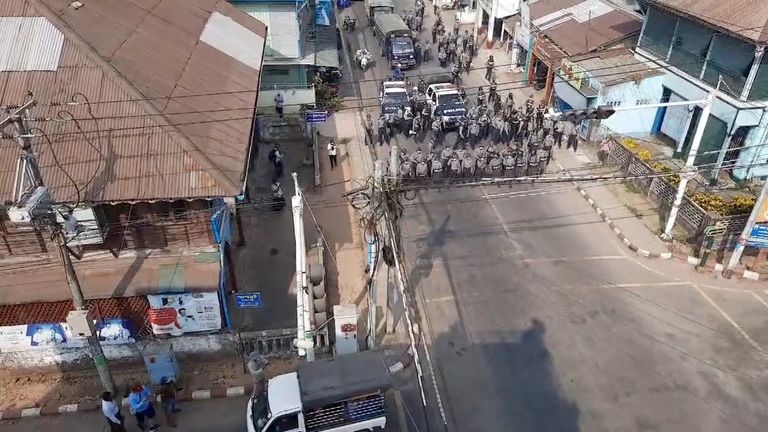 Police form up at a junction in Dawei