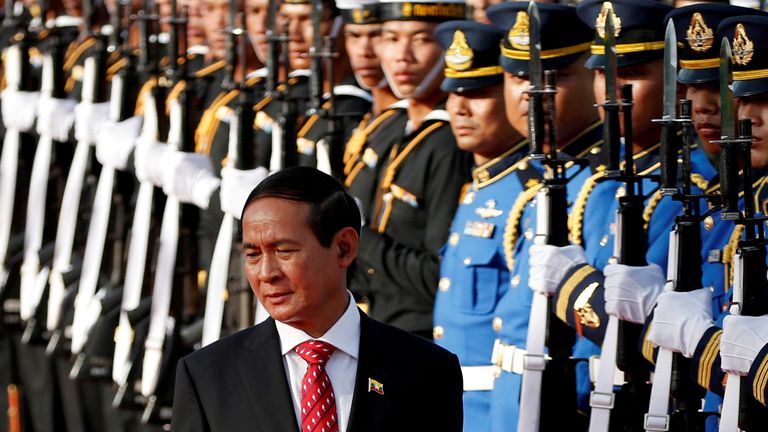 Myanmar&#39;s President Win Myint reviews the honor guard during his welcome ceremony at the Government House in Bangkok, Thailand