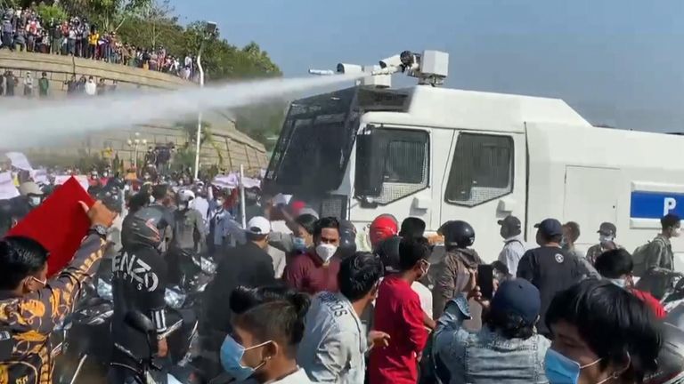 Myanmar police fire water cannon at protesters