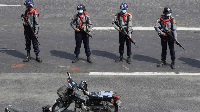 Police stand guard in Naypyitaw - there are fears deadly force could end up being used