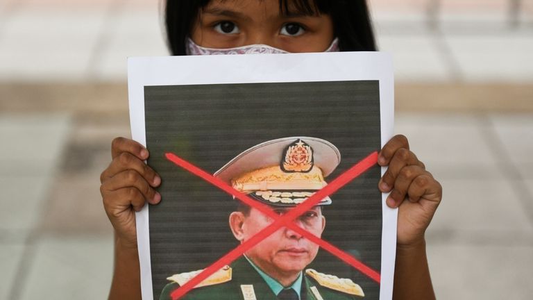 A girl protests against the military coup in Myanmar outside the United Nations in Bangkok
