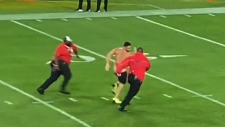 A field invader wearing shorts and a pink swimsuit took to the field during Super Bowl LV between the Tampa Bay Buccaneers and Kansas City Chiefs on February 7.