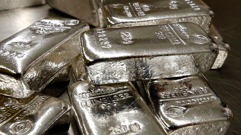Silver bars are stacked on a table in the safe deposit boxes room of the ProAurum gold house in Munich March 3, 2014.