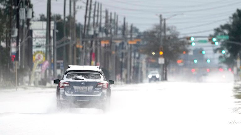 Vehicles drive on snow and sleet covered roads in Spring. Pic: Associated Press
