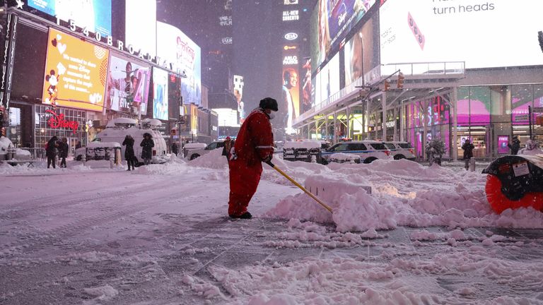 A worker clears a New York pavement