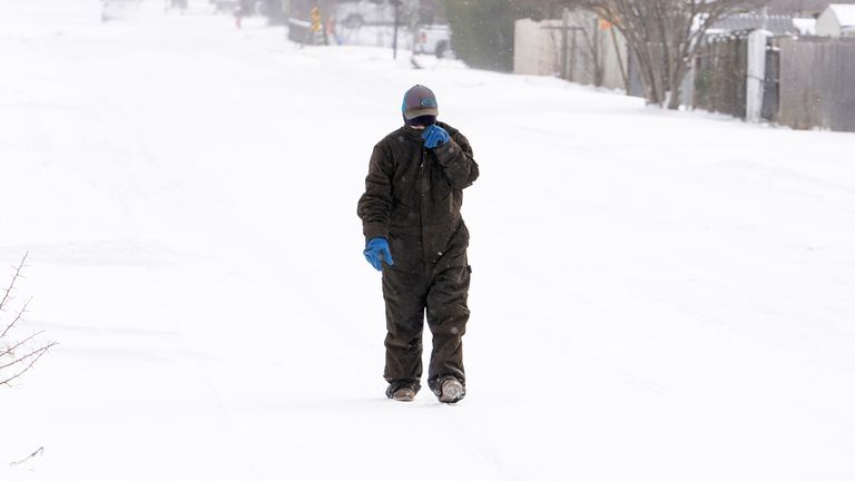 A woman braves the snow in Oklahoma City