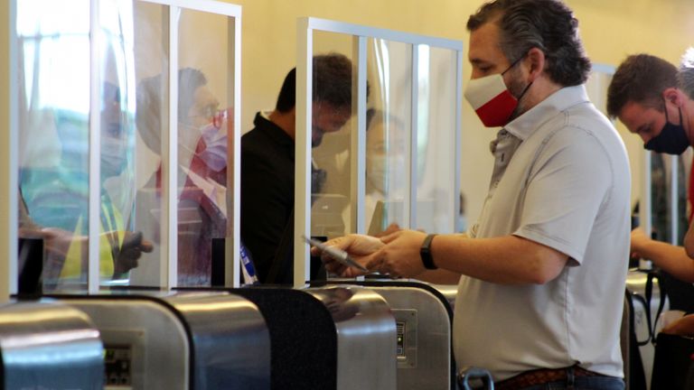 Ted Cruz at the check-in desk in Cancun