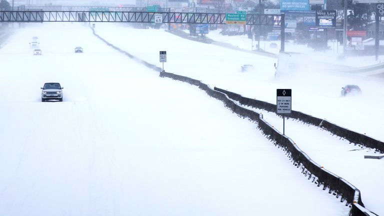 In this Feb. 15, 2021, file photo, traffic is sparse on the snow-covered Interstate 45 near The Woodlands Parkway following an overnight snowfall in The Woodlands, Texas. (Brett Coomer/Houston Chronicle via AP, File)