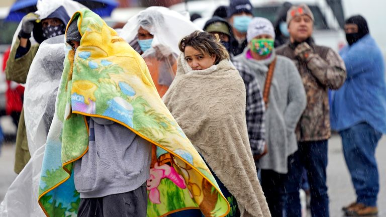 People wait in line to fill propane tanks Wednesday, Feb. 17, 2021, in Houston. Customers waited over an hour in the freezing rain to fill their tanks. Millions in Texas still had no power after a historic snowfall and single-digit temperatures created a surge of demand for electricity to warm up homes unaccustomed to such extreme lows, buckling the state&#39;s power grid and causing widespread blackouts. (AP Photo/David J. Phillip)