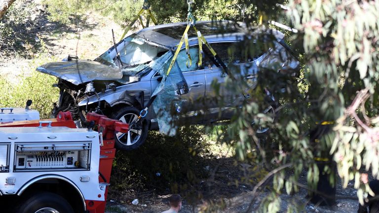 The golfer had to be pried from the car through the windscreen