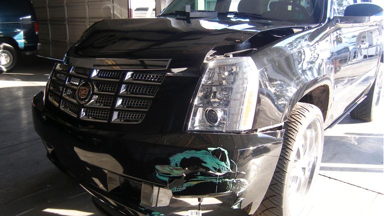 Wood&#39;s damaged Cadillac is seen after the 2009 crash 