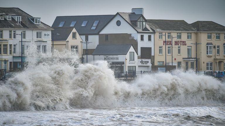 Waves crash along Porthcawl promenade in South Wales