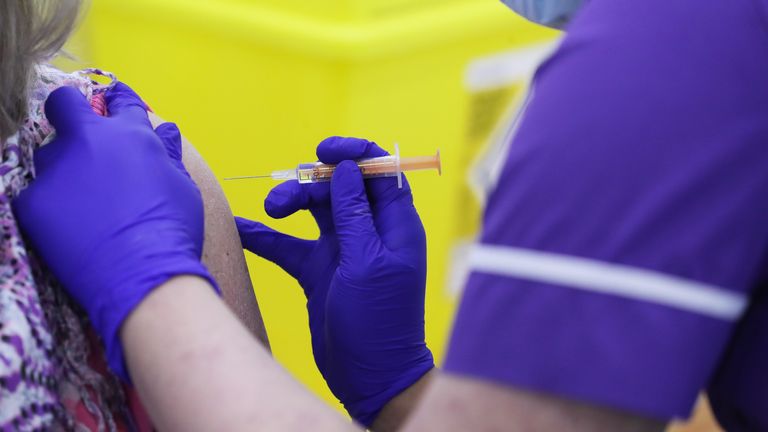 A member of the public receives the Oxford/AstraZeneca coronavirus vaccine at the Elland Road vaccination centre in Leeds. Picture date: Monday February 8, 2021.
