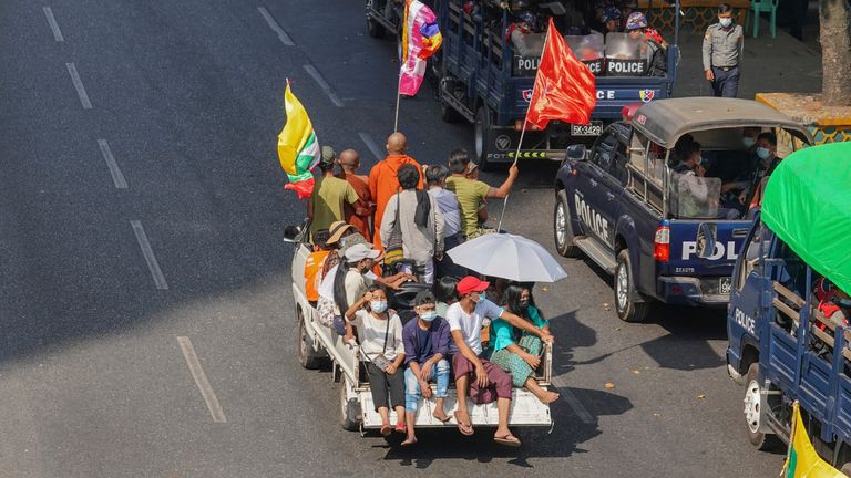 A vehicle carries supporters of the military in Myanmar. Pic: AP