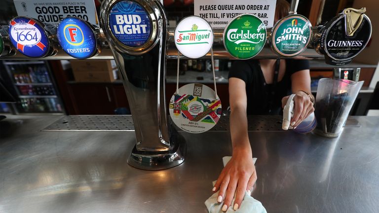 The bar is cleaned in a Wetherspoons pub The Mossy Well in Muswell Hill, London, ahead of pubs reopening on July 4, as further coronavirus lockdown restrictions are lifted in England. PA Photo. Picture date: Wednesday July 1, 2020. See PA story HEALTH Coronavirus. Photo credit should read: Yui Mok/PA Wire..