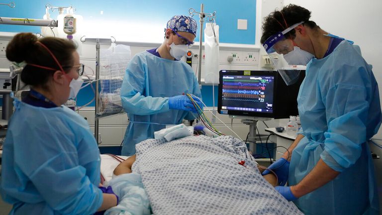 Critical care staff look after a COVID-19 patient at King&#39;s College Hospital, London. Pic: AP
