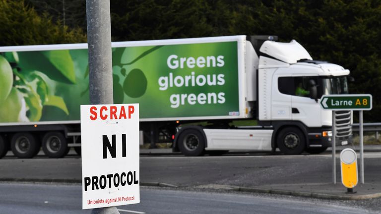 A sign is seen with a message against the Brexit border checks in relation to the Northern Ireland protocol at the harbour in Larne, Northern Ireland February 12, 2021. REUTERS/Clodagh Kilcoyne