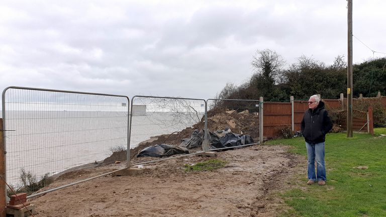 Edd Cane, stands in his garden which now sits next to the cliff edge in Eastchurch, on the Isle of Sheppey, Kent, where residents continue to find a way to save their homes from plunging over the cliff edge. Picture date: Thursday March 4, 2021. Picture date: Thursday March 4, 2021.