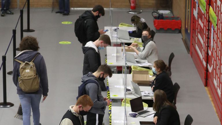 Students register for an asymptomatic test using lateral flow antigen at a test centre at Edinburgh University ahead of students being allowed to travel home for the Christmas holidays.