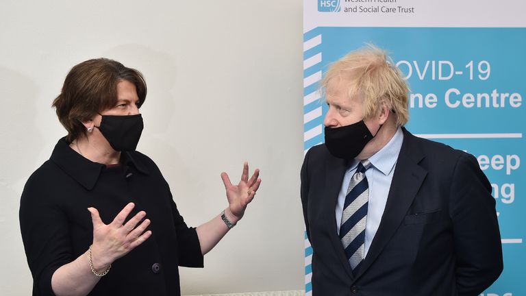 Prime Minister Boris Johnson speaks with First Minister Arlene Foster during a visit to the Lakeland Forum vaccination centre in Enniskillen, Northern Ireland. Picture date: Friday March 12, 2021.