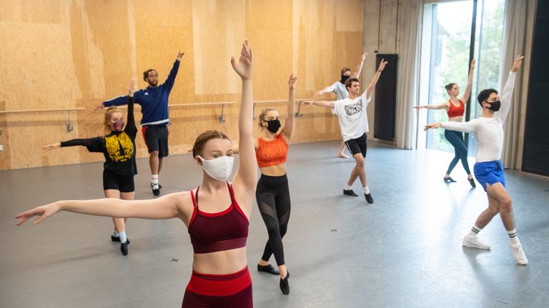 Students observe social distancing as they take part in a dance session as classes resume at Mountview Academy of Theatre Arts drama school in Peckham, south London, following its closure due to coronavirus.