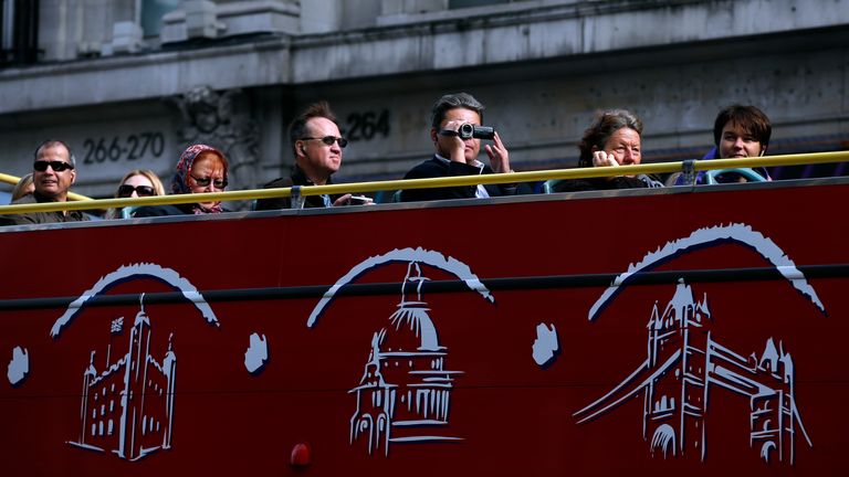 Tourists on a bus tour in central London.