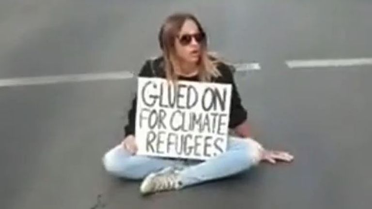 Climate activist glues herself to road in Adelaide