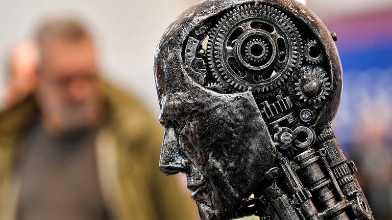 FILE - In this Nov. 29, 2019, file photo, a metal head made of motor parts symbolizes artificial intelligence, or AI, at the Essen Motor Show for tuning and motorsports in Essen, Germany. The Trump administration is proposing new rules guiding how the U.S. government regulates the use of artificial intelligence in medicine, transportation and other industries. The White House unveiled the proposals Tuesday, Jan. 7, and said they're meant to promote private sector applications of AI that are safe