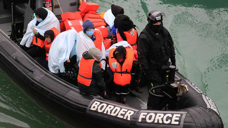 Note to eds: The picture at the bottom has been pixelated as the PA Picture Desk has been unable to gain the necessary permission to photograph a child under 16 on issues involving their welfare. The picture is also provided unpixelated for newspapers to pixelate in their own style. A group of people including young children are brought in to Dover, Kent, by Border Force officers following a small boat incident in the Channel.