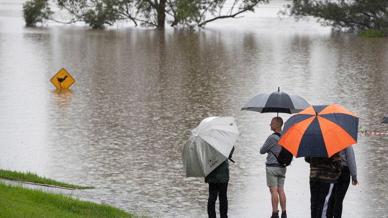 Hundreds of people have been rescued from floodwaters that have isolated dozens of towns