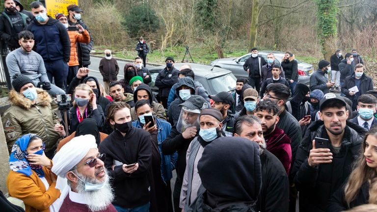 A local community leader speaks to the crowd of parents. Angry parents are protesting outside a Batley Grammar School, West Yorks, after a teacher allegedly showed derogatory caricatures of the Prophet Muhammad, pictured in West Yorks, March 25 2021. See SWNS story SWLEprotest.