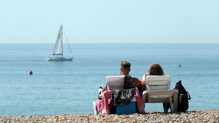 People enjoy the weather at Brighton beach, West Sussex, as the UK could see record-breaking temperatures with forecasters predicting Friday as the hottest day of the year. PA Photo. Picture date: PA Photo. Picture date: Friday August 7, 2020. See PA story WEATHER Hot. Photo credit should read: Steve Parsons/PA Wire.