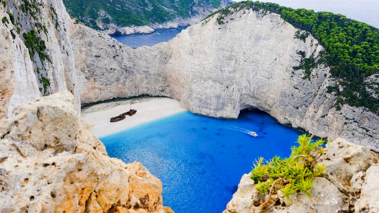 Navagio Beach on Zakynthos - Greece has said it will welcome Brits back but it&#39;s unclear when tourist flights will be legal again. Pic: AP