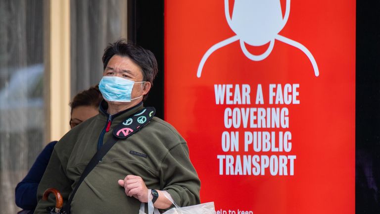 PABest..A man wearing a protective face mask waits at a bus stop in central London displaying a notice advising passengers to wear a face covering on public transport, following the announcement that wearing a face covering will be mandatory for passengers on public transport in England from June 15. PA Photo. Picture date: Friday June 5, 2020. See PA story HEALTH Coronavirus. Photo credit should read: Dominic Lipinski/PA Wire..