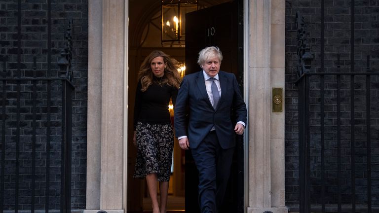Prime Minister Boris Johnson and Carrie Symonds walk out of Number 10 Downing Street
