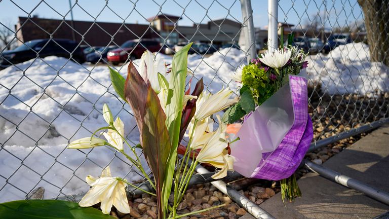 A small memorial stands along a makeshift fence put up around the parking lot outside a King Soopers grocery store where a mass shooting took place Tuesday, March 23, 2021, in Boulder, Colo. (AP Photo/David Zalubowski).............