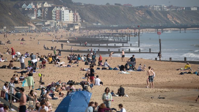 People enjoy the warm weather on Bournemouth beach on Tuesday