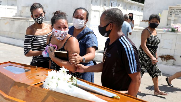 Relatives of Luiz Alves, 63, at his funeral in Rio - Brazil has the world&#39;s second-highest COVID death toll