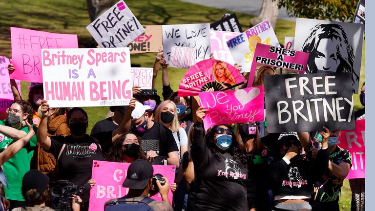 Fans hold &#39;Free Britney&#39; placards outside the court hearing in Los Angeles. Pic: AP