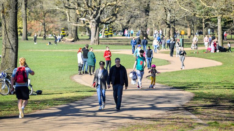 People take a walk in Bute Park, Cardiff in sunny weather. Picture date: Sunday February 28, 2021.