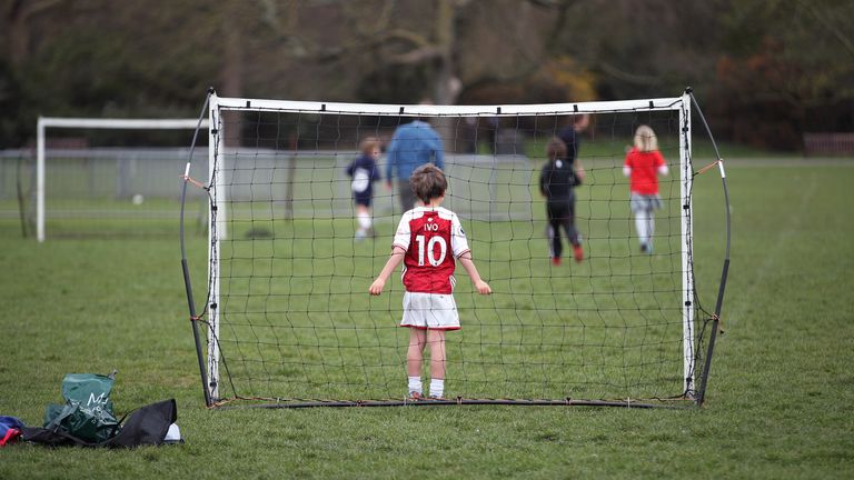 Children playing football in Battersea Park, London during England&#39;s third national lockdown to curb the spread of coronavirus. Picture date: Sunday March 28, 2021.