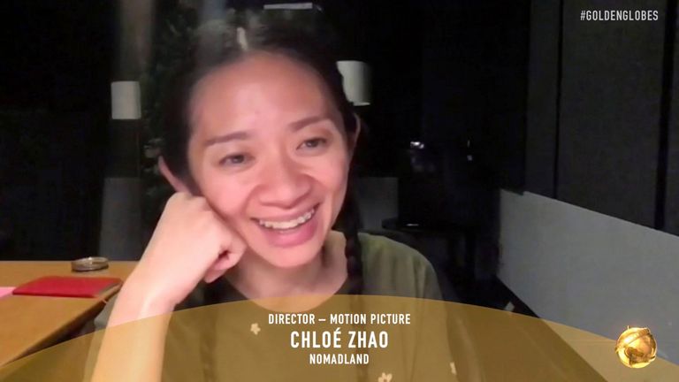 Chloe Zhao accepts the award for best director for a motion picture for Nomadland at the Golden Globes 2021: NBC/AP